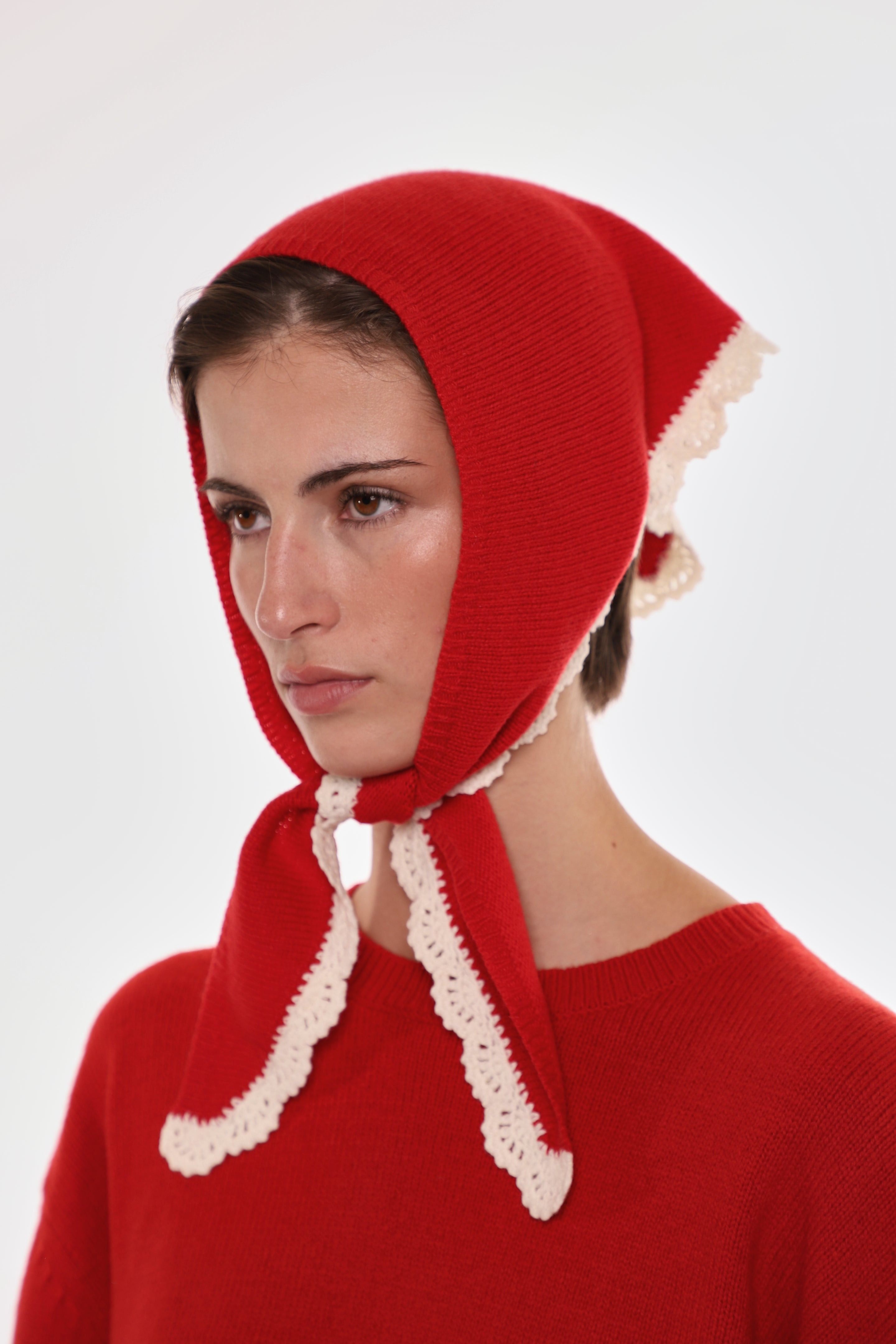 Model wearing a Sandy Liang knit bonnet.