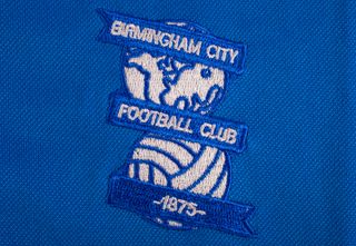 The Birmingham City badge on a blue shirt