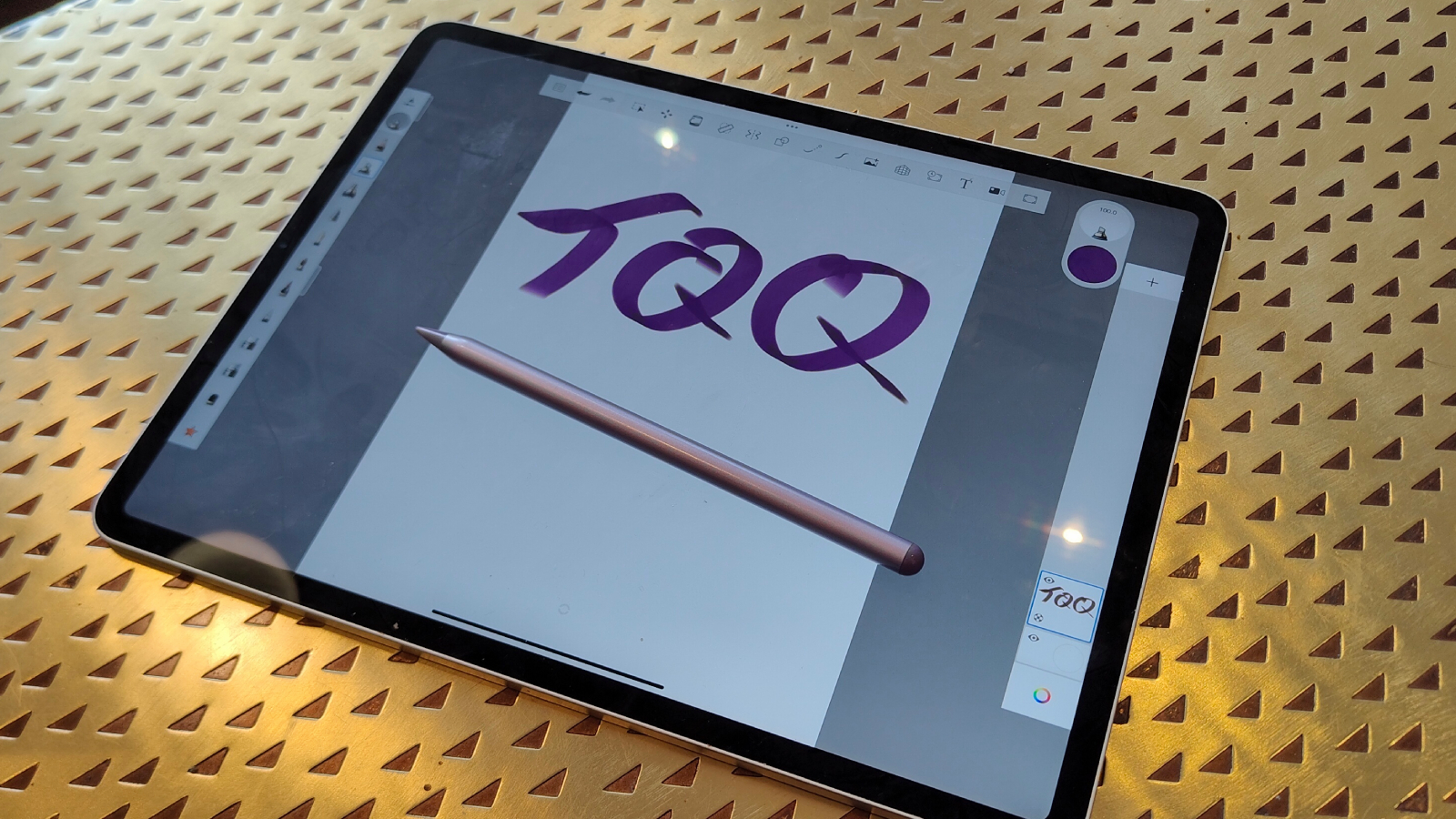 The TQQ pencil on top of an iPad.