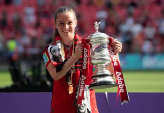 Ella Toone of Manchester United Women (M) poses with the Womens FA Cup trophy after the Adobe Women's FA Cup Final match between Manchester United and Tottenham Hotspur at Wembley Stadium on May 12, 2024 in London, England. (Photo by Visionhaus/Getty Images)