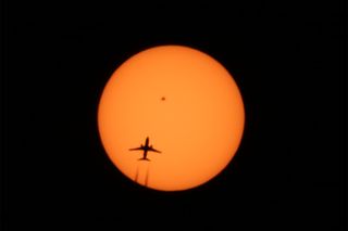 Alexander Krivenyshev of New York City captured this photo of an airplane crossing the sun's face on April 13, 2016. The heart-shaped sunspot AR 2529 is clearly visible.