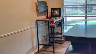 A bar table repurposed as a DIY standing desk