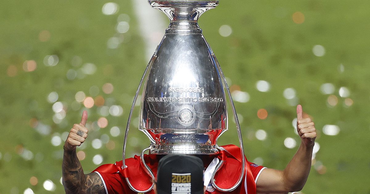 Bayern Munich&#039;s French defender Lucas Hernandez poses with the trophy upside down on his head after Bayern won the UEFA Champions League final football match between Paris Saint-Germain and Bayern Munich at the Luz stadium in Lisbon on August 23, 2020.