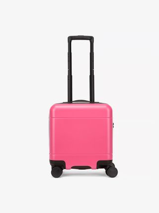 The Calpak Hue Mini Carry-On in dragonfruit pink