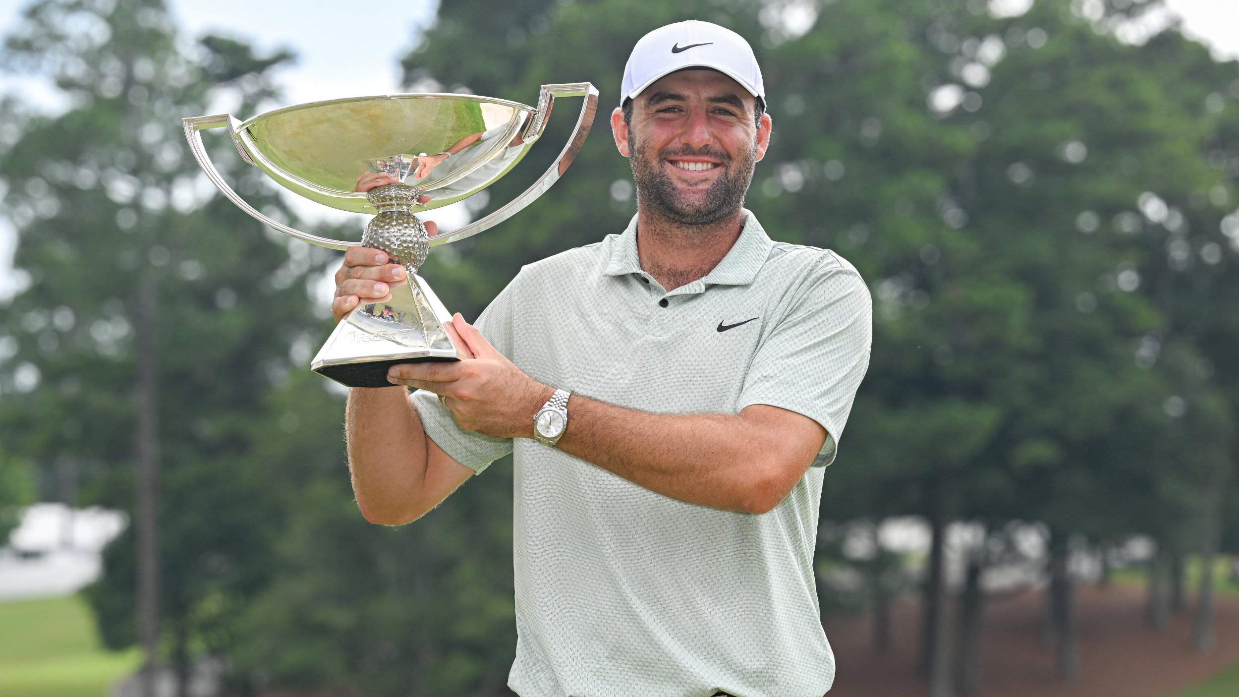 Scottie Scheffler with the FedEx Cup trophy