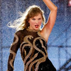 Taylor Swift wears a new Reputation bodysuit with gold snakes by Roberto Cavalli onstage at the Eras Tour in Miami