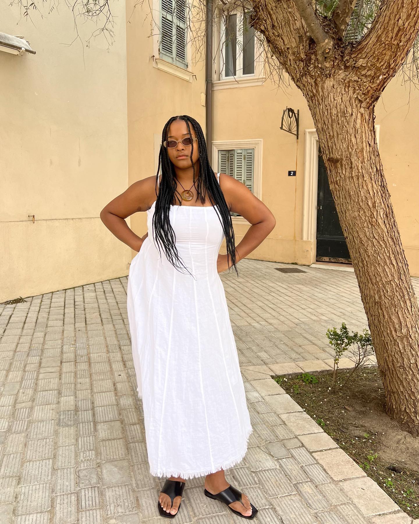 Woman in white linen dress.