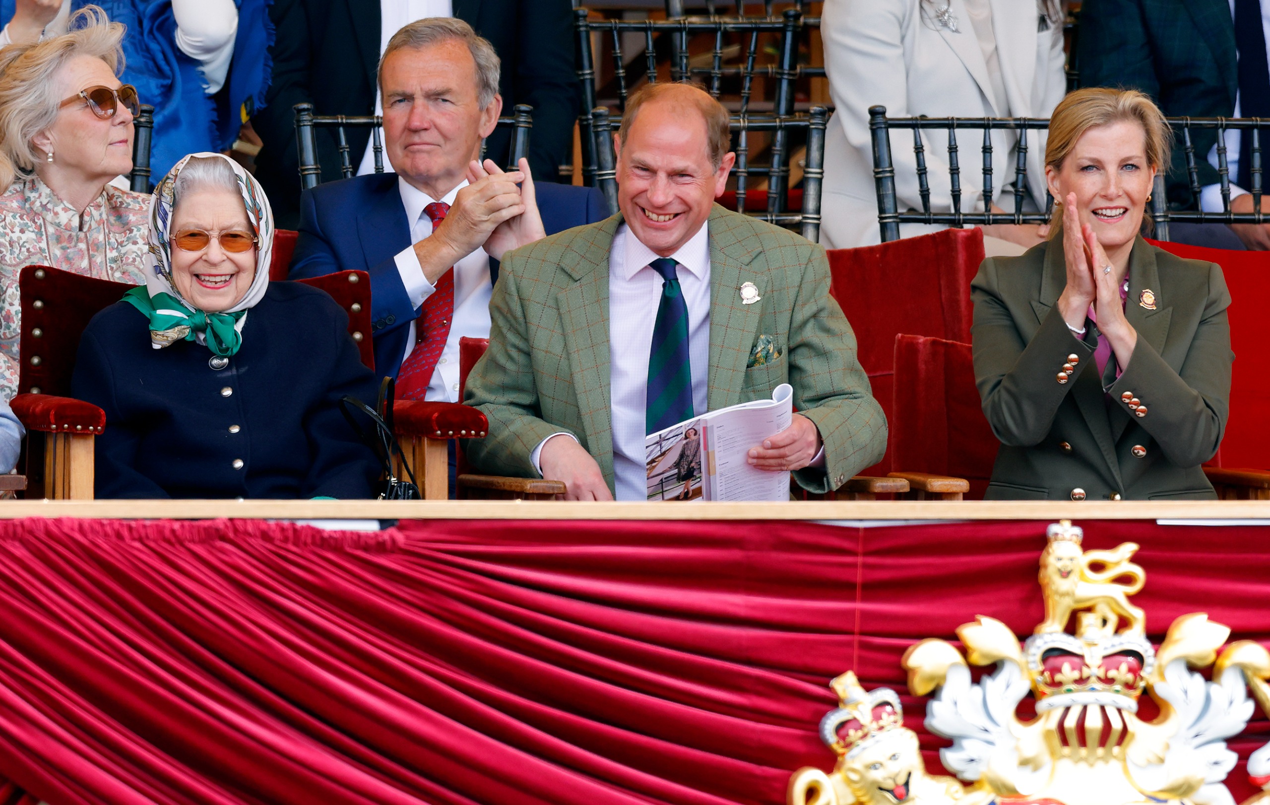 Queen Elizabeth sitting next to Prince Edward and Duchess Sophie