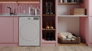 pink utility room with dog bed and shoe storage