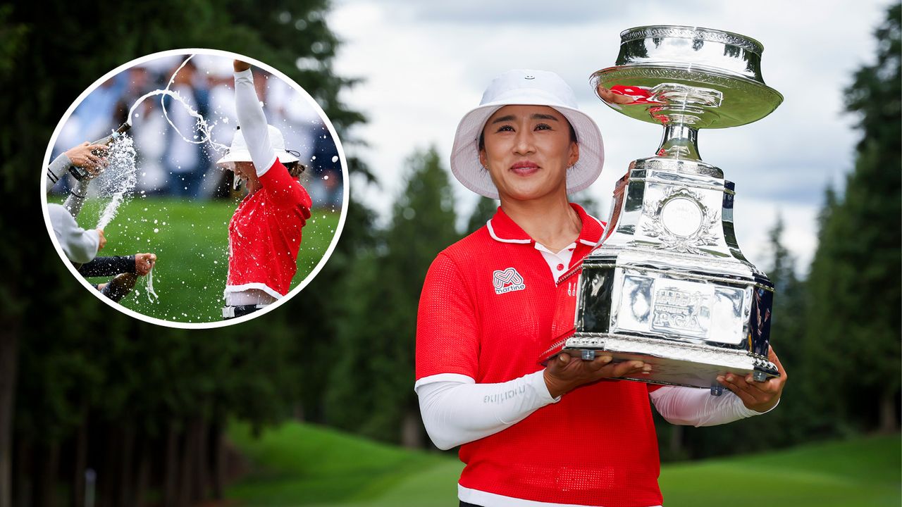 Amy Yang celebrates and holds the trophy after winning the KPMG Women&#039;s PGA Championship