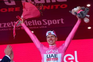 Team UAE's Slovenian rider Tadej Pogacar celebrates his Pink Jersey of the overall leader during the podium ceremony of the 4th stage of the 107th Giro d'Italia cycling race, 190 km between Acqui Terme and Andora, on May 7, 2024 in Andora. (Photo by Luca Bettini / AFP)