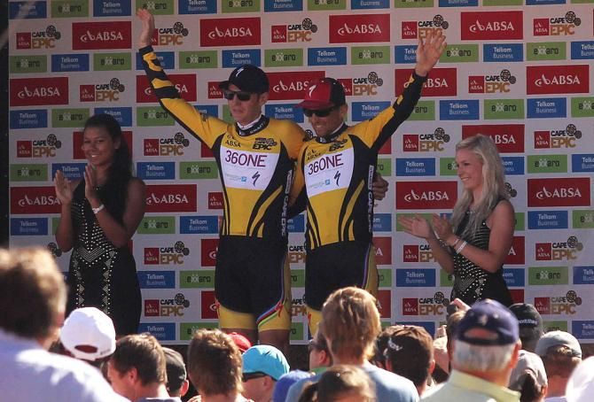 Jaroslav Kulhavy and Christoph Sauser of Burry Stander-Songo celebrate after receiving the race leaders' jerseys