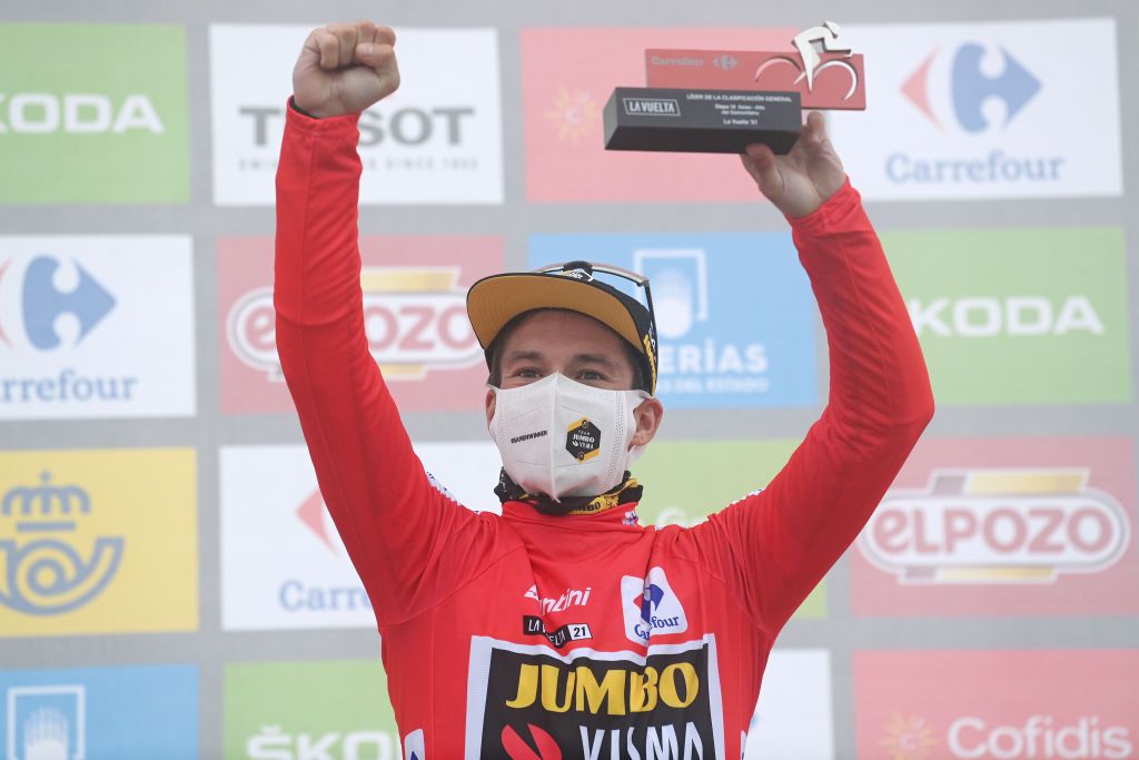 ALTU DEL GAMONITEIRU SPAIN SEPTEMBER 02 Primoz Roglic of Slovenia and Team Jumbo Visma celebrates winning the red leader jersey on the podium ceremony after the 76th Tour of Spain 2021 Stage 18 a 1626km stage from Salas to Altu dEl Gamoniteiru 1770m lavuelta LaVuelta21 on September 02 2021 in Altu dEl Gamoniteiru Spain Photo by Stuart FranklinGetty Images