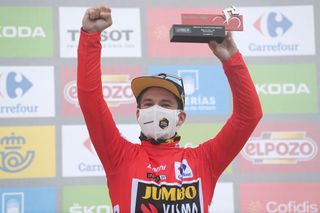 ALTU DEL GAMONITEIRU SPAIN SEPTEMBER 02 Primoz Roglic of Slovenia and Team Jumbo Visma celebrates winning the red leader jersey on the podium ceremony after the 76th Tour of Spain 2021 Stage 18 a 1626km stage from Salas to Altu dEl Gamoniteiru 1770m lavuelta LaVuelta21 on September 02 2021 in Altu dEl Gamoniteiru Spain Photo by Stuart FranklinGetty Images