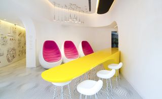 Egg shaped chairs, form shaped counter with stools for seating