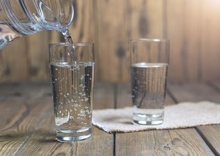 Two glasses filled with water.