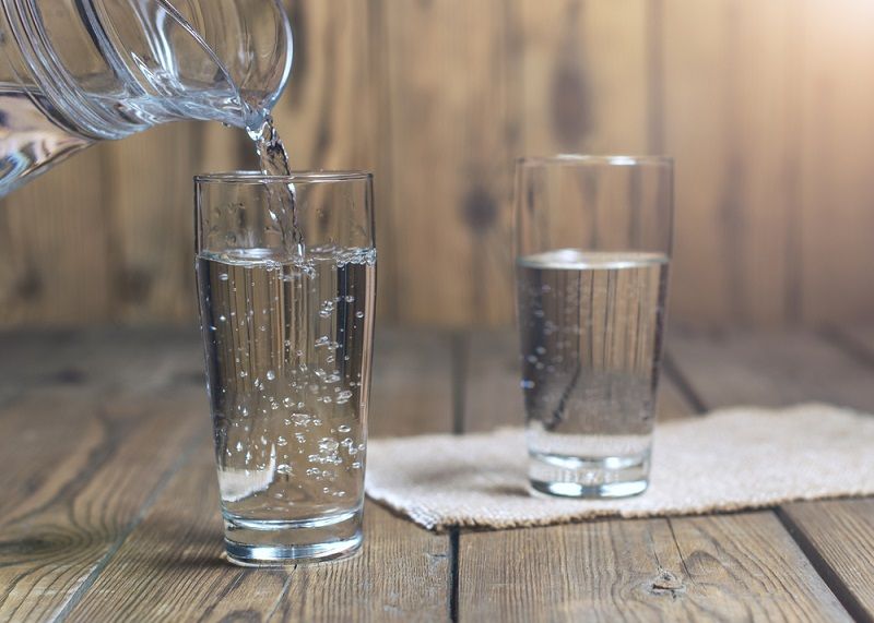 Two glasses filled with water.