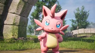 Palworld 1.0 launch trailer screenshot shows a cat-like Pal called Cattiva reaching out its paw.