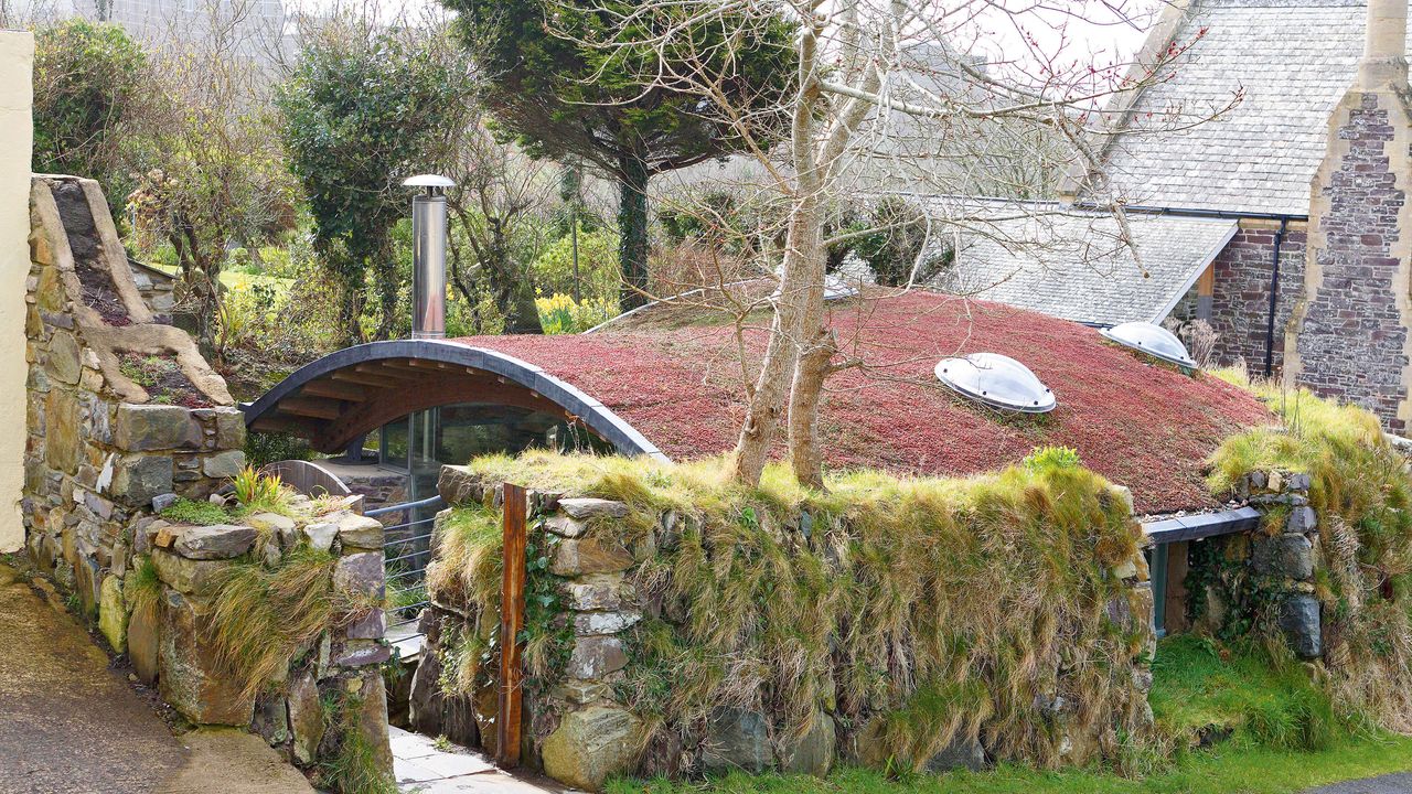 Cottage with curved green roof