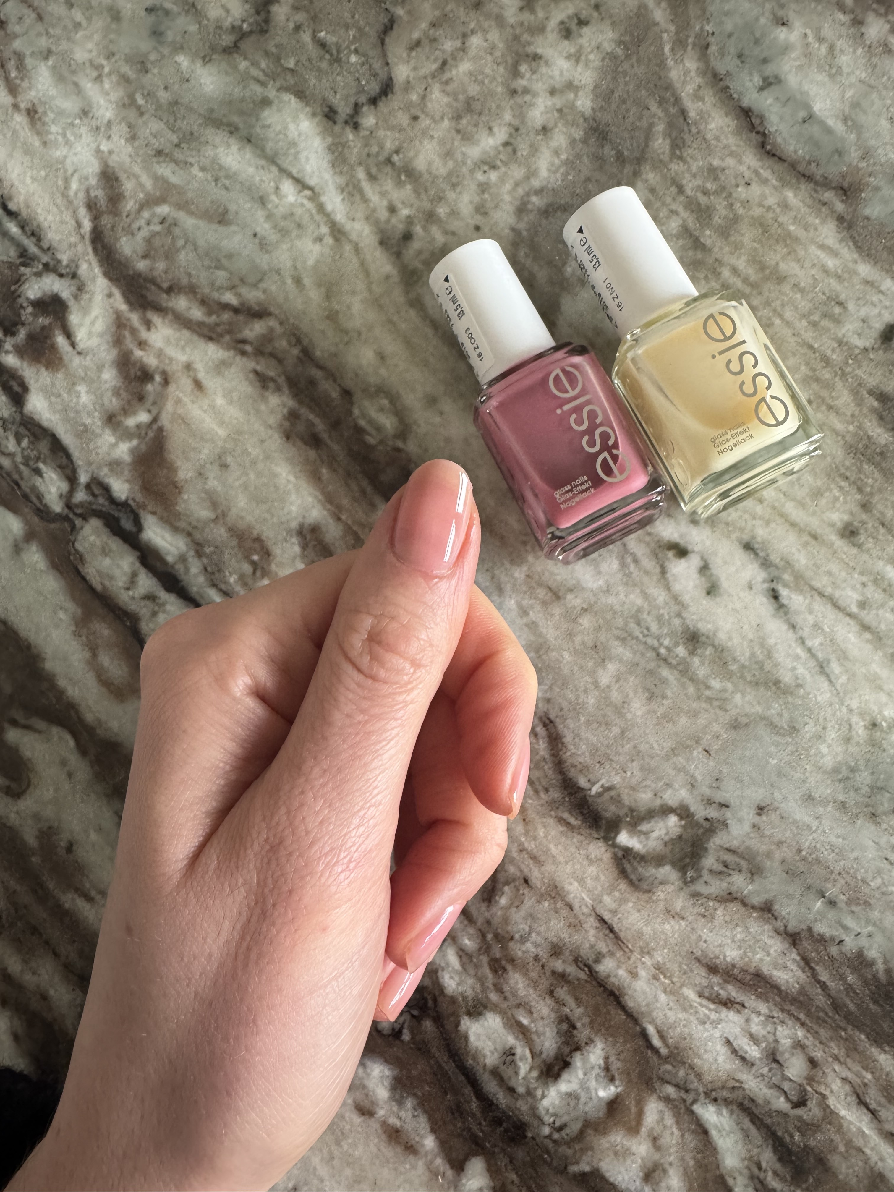 Essie Glass Nails polishes in shades Cin Cin and Crystal Ball layered on Eleanor's thumbnail