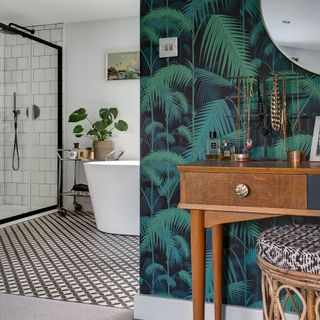 monochrome bathroom makeover with blue and green leaf design feature wall
