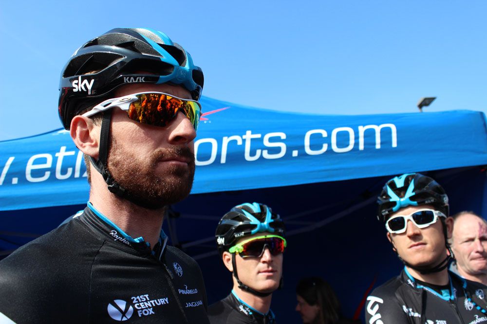 Bradley Wiggins waits to sign on
