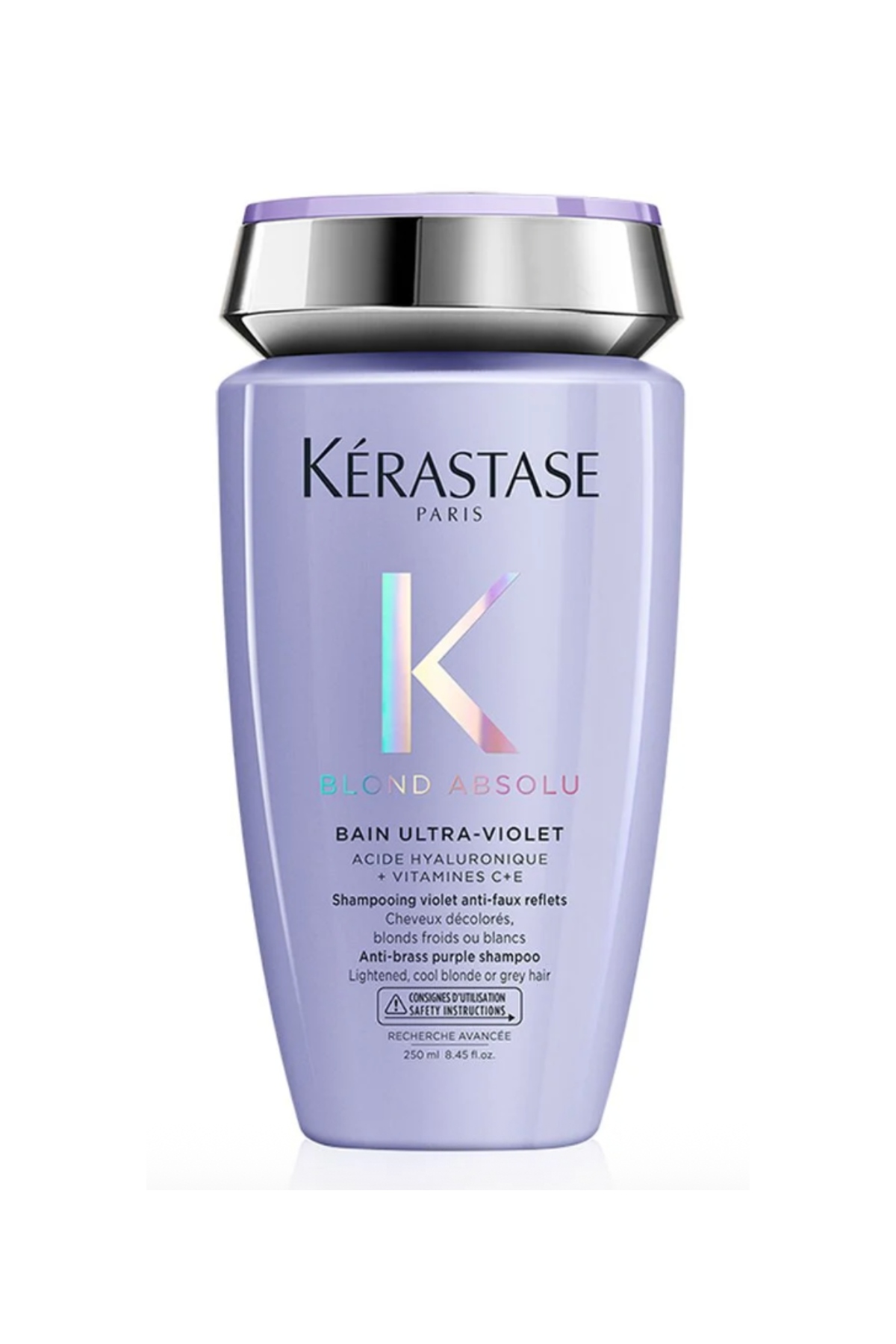 a purple bottle of kerastase shampoo with black writing