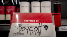 A graffiti scrawl urges consumers to boycott an American wine at an off-licence in Montreal