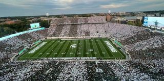 The Michigan State football field with a stadium packed with fans enjoying sounds provided by Fulcrum Acoustics.