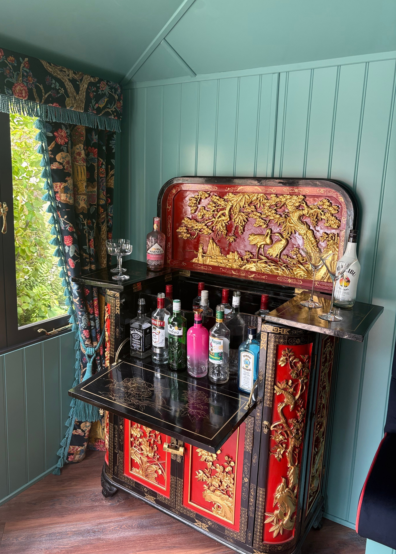 An outdoor shed with a maximalist bar at the Chelsea Flower Show 2026