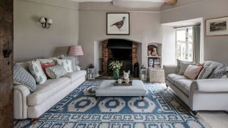 cream living room with inglenook fireaplace