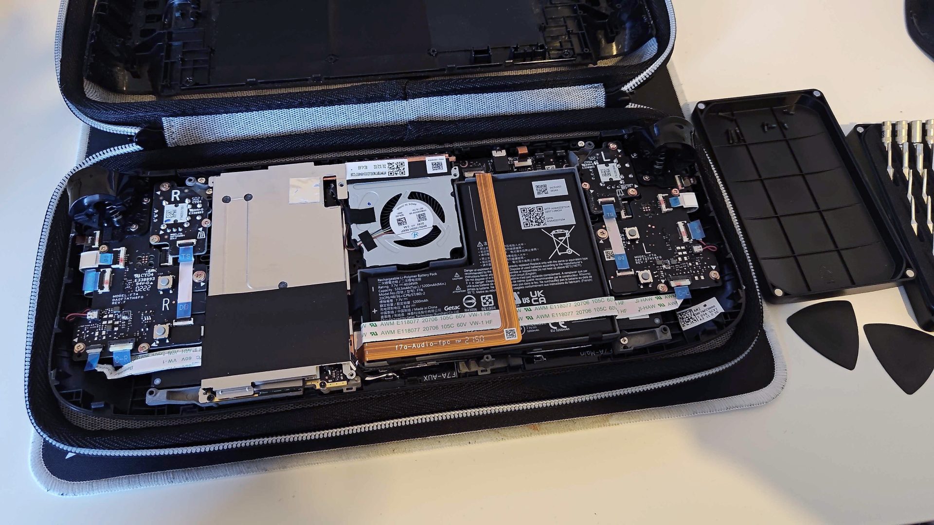 Steam Deck LCD with front panel and screen removed to reveal internal components.