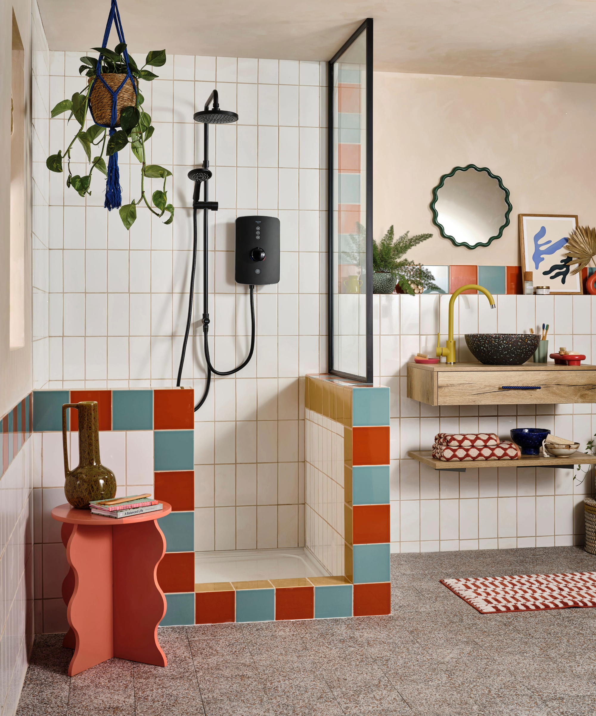Shower with red and blue multi coloured tiled trim