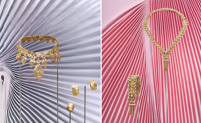 A selection of gold necklaces and assorted jewellery displayed against an abstract background