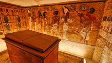a view inside King Tut's tomb with murals on the walls