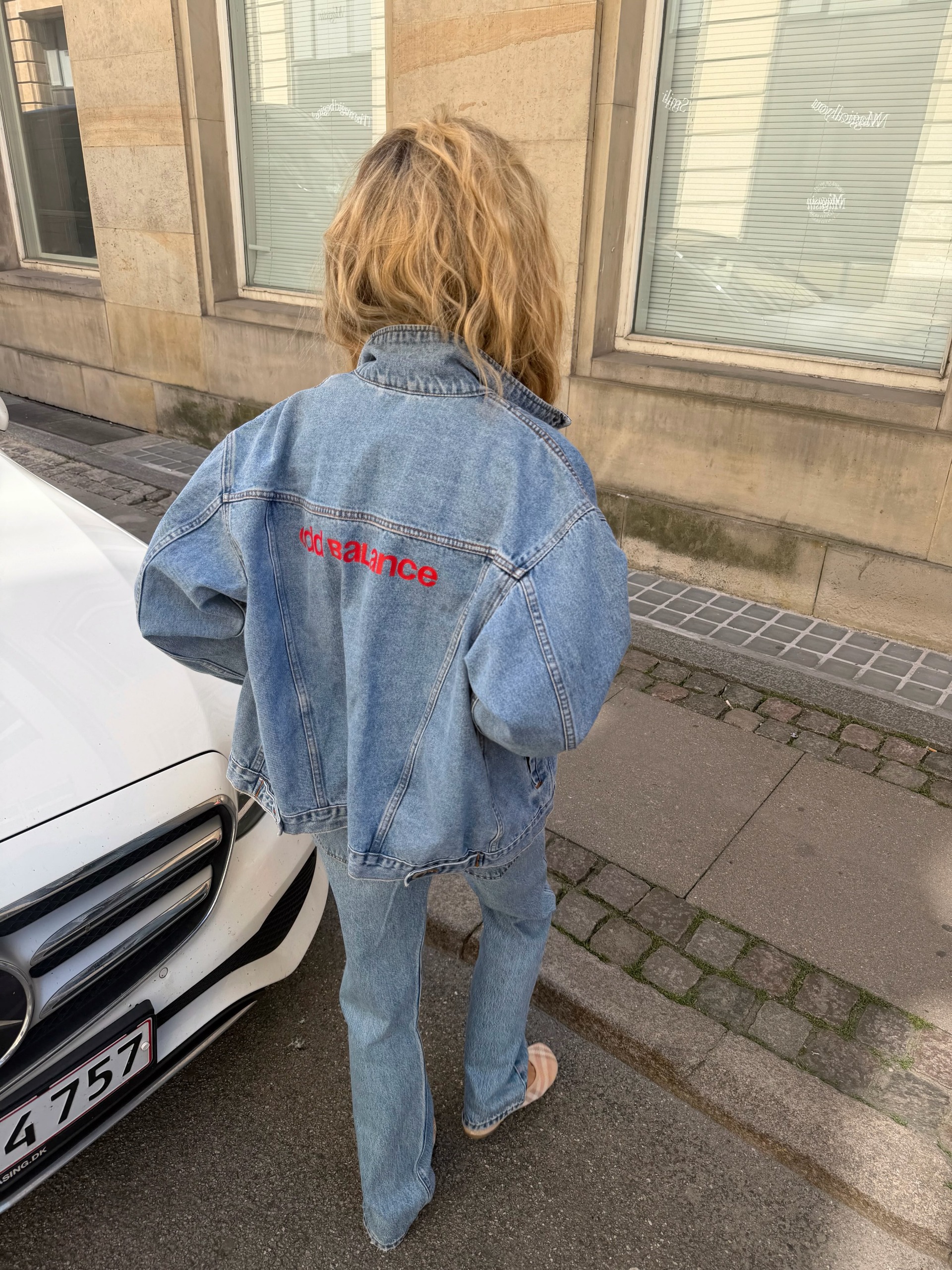 A woman wearing low rise bootcut jeans in 2026.