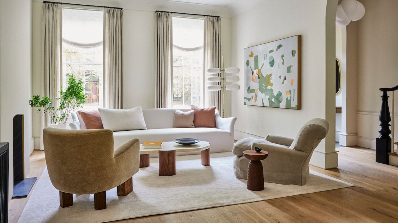 Neutral tone rug and accent chairs in a modern home