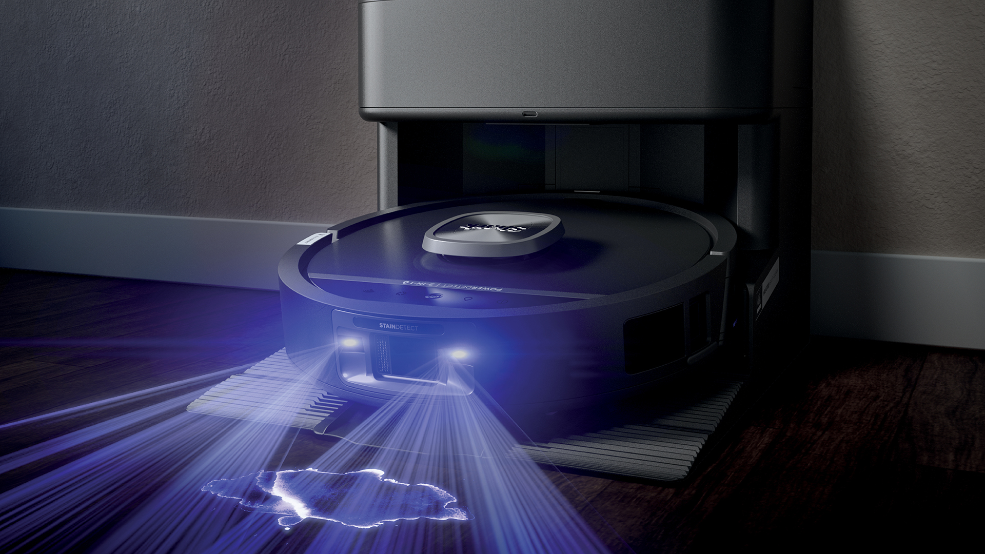 رسم يوضح روبوت Shark PowerDetect UV Reveal الذي يقوم بتنظيف الغرفة بالمكنسة الكهربائية