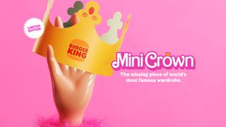Plastic barbie hand holding a Burger King crown