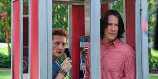 Bill (Alex Winters) holds a telephone as he stands need to Ted (Keanu Reeves) in a booth in 'Bill and Ted Face the Music'