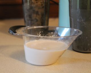 Almond milk made from scratch in a measuring jug