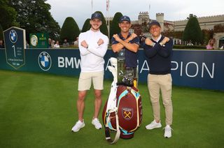 Declan Rice, Billy Horschel and Mark Noble pose next to a West Ham bag following Horschel's victory at the BMW PGA Championship