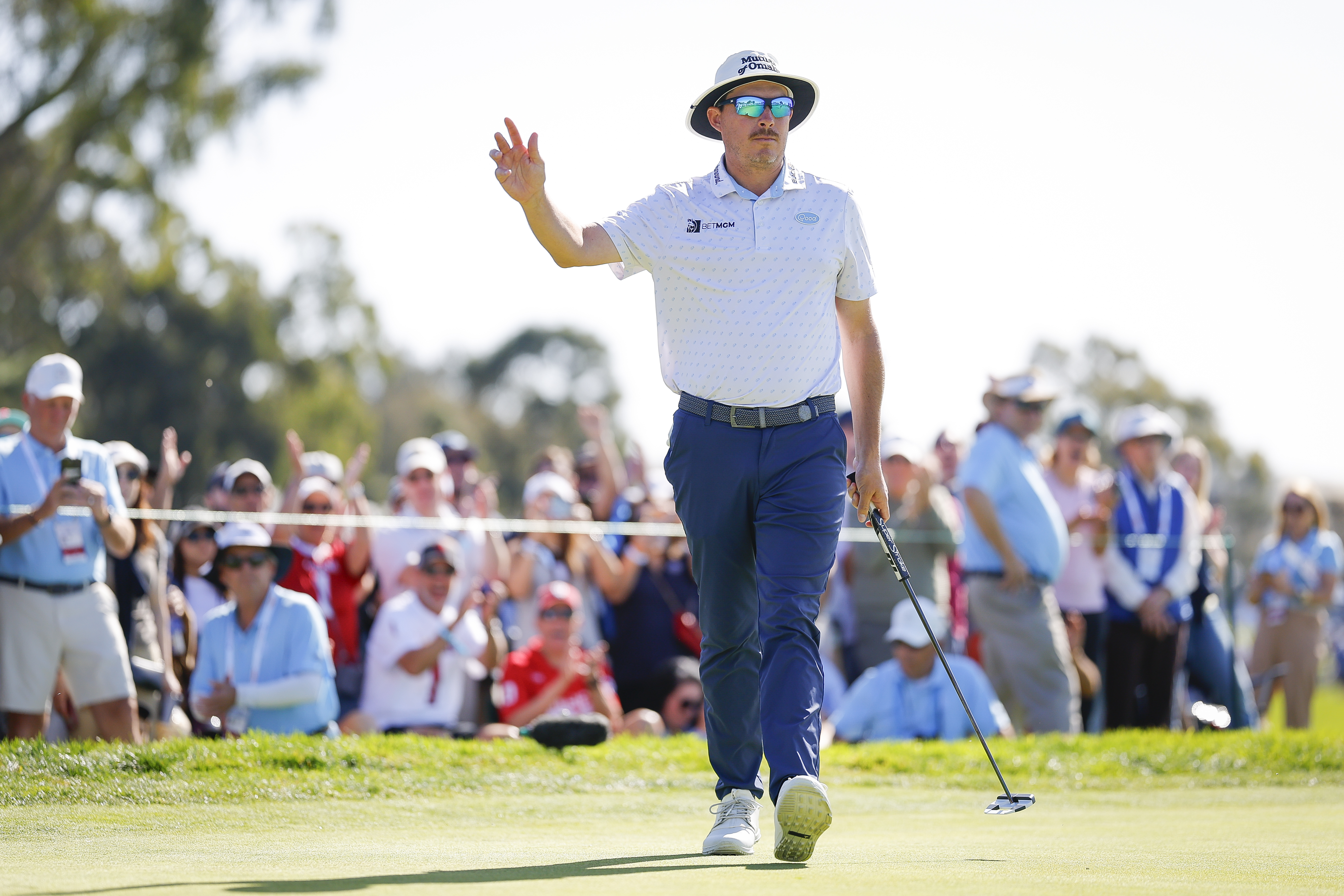 Joel Dahmen waves to the crowd