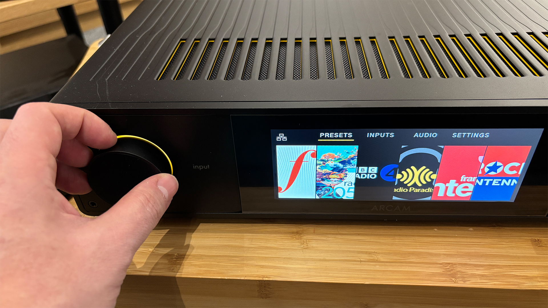 Arcam SA35 music streamer with hand adjusting input dial