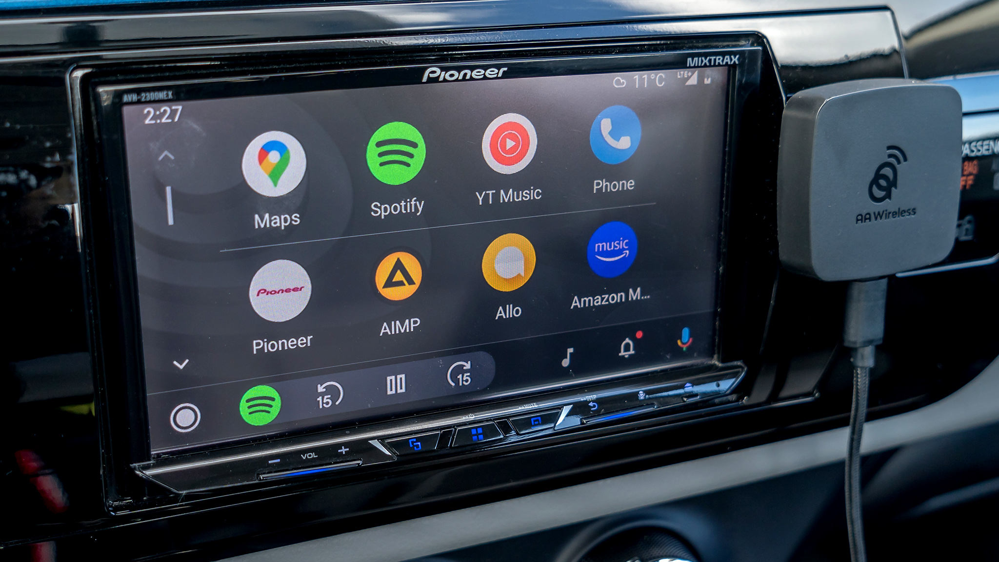 AAWireless attached to dash next to Android Auto screen.