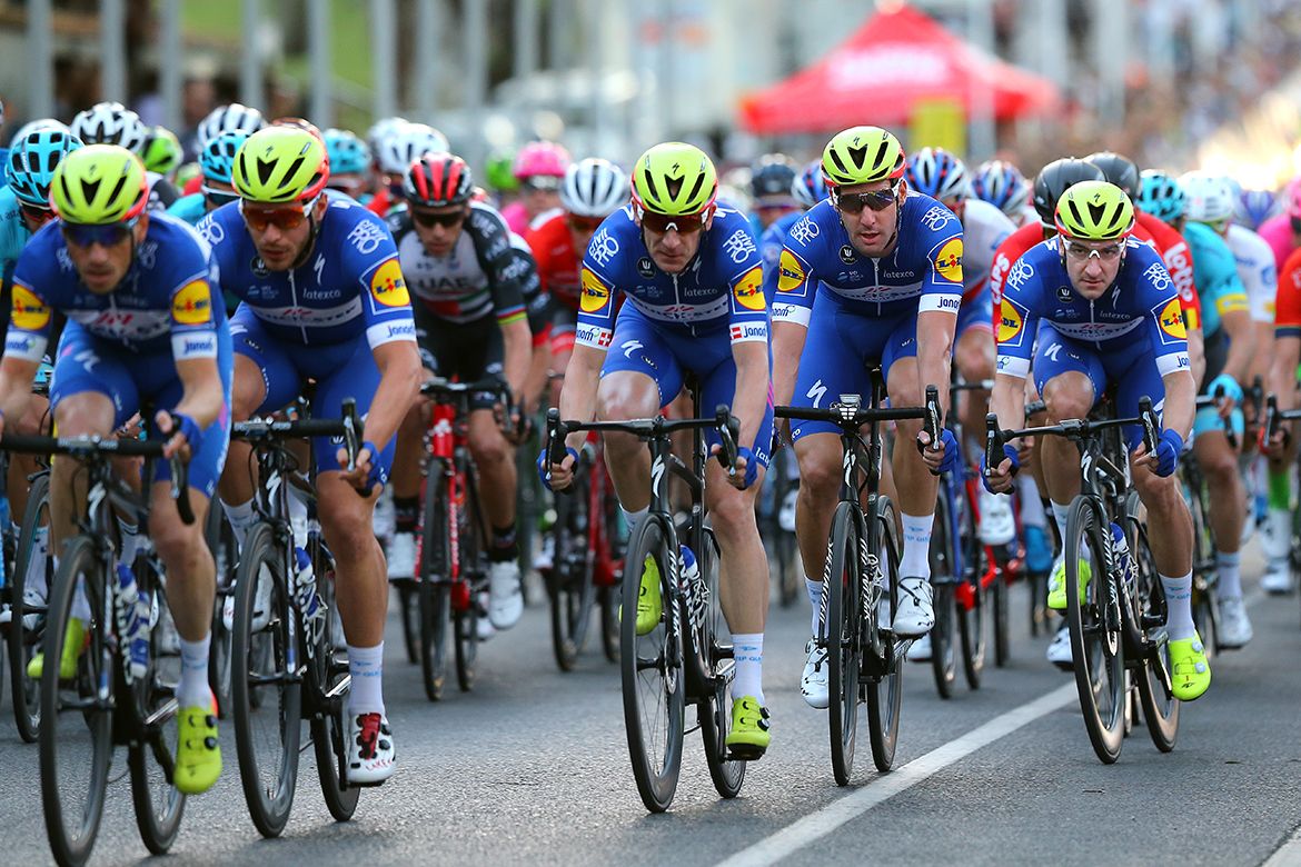 Elia Viviani surrounded by Quick-Step Floors teammates.