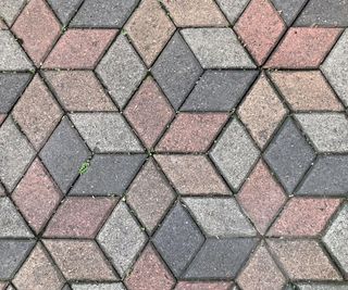 Seamless paving stone pavement texture in hexagonal geometric cube pattern.