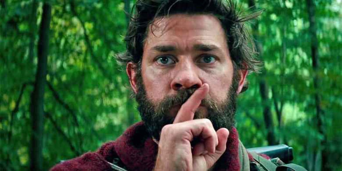 John Krasinski covers mouth with finger shhh A Quiet Place