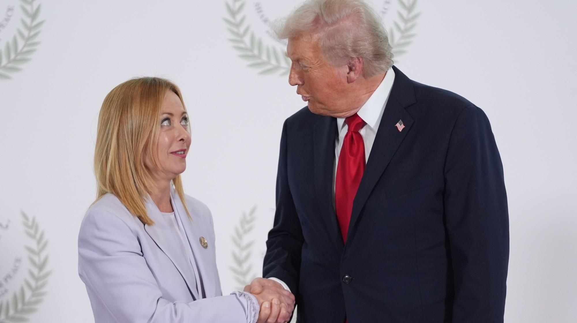 U.S. President Donald Trump (R) greets Italy's Prime Minister Giorgia Meloni during a summit of European and Middle Eastern leaders on October 13, 2025 in Sharm El Sheikh, Egypt. 