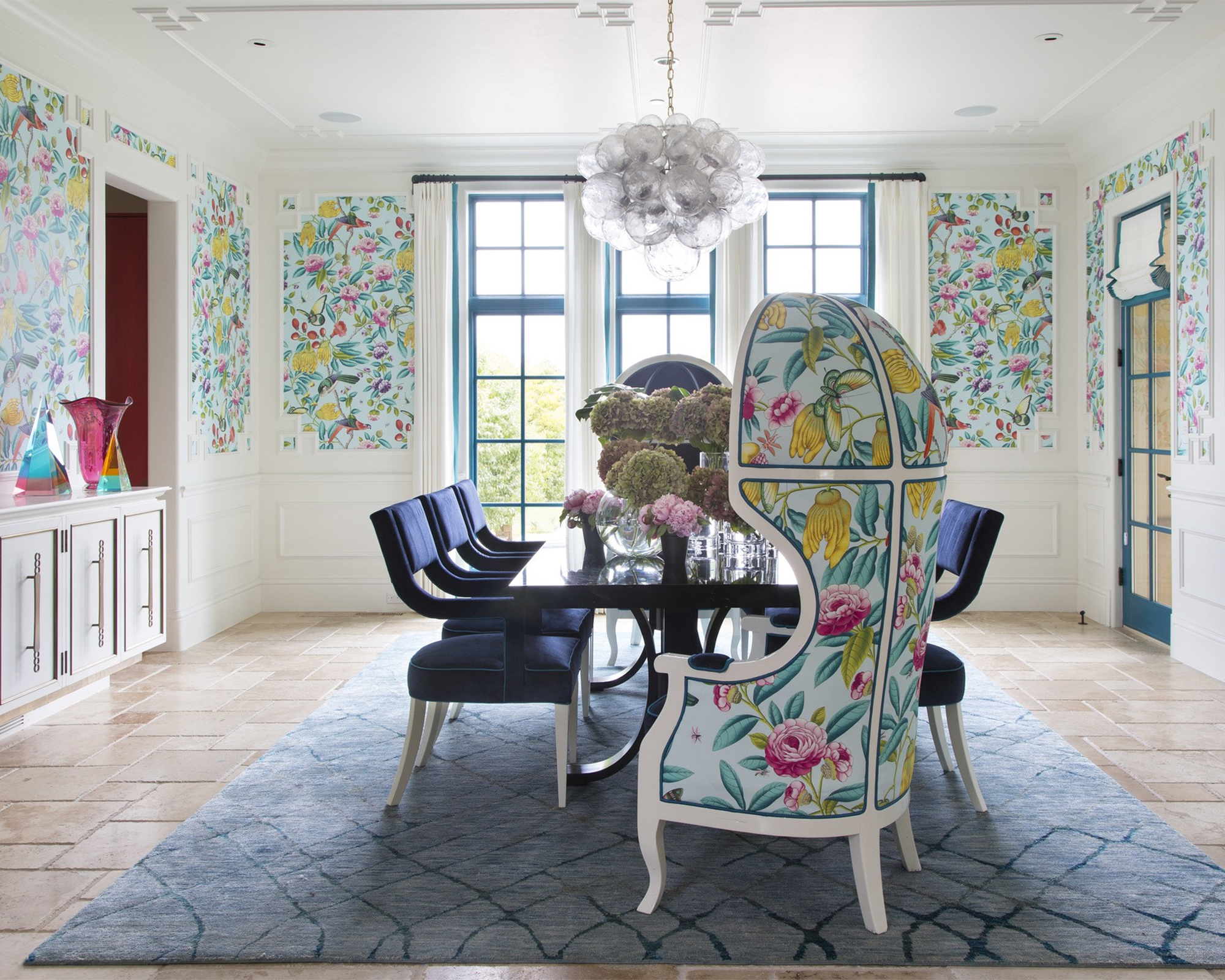 Traditional dining room with printed wallpaper design and coordinated chair